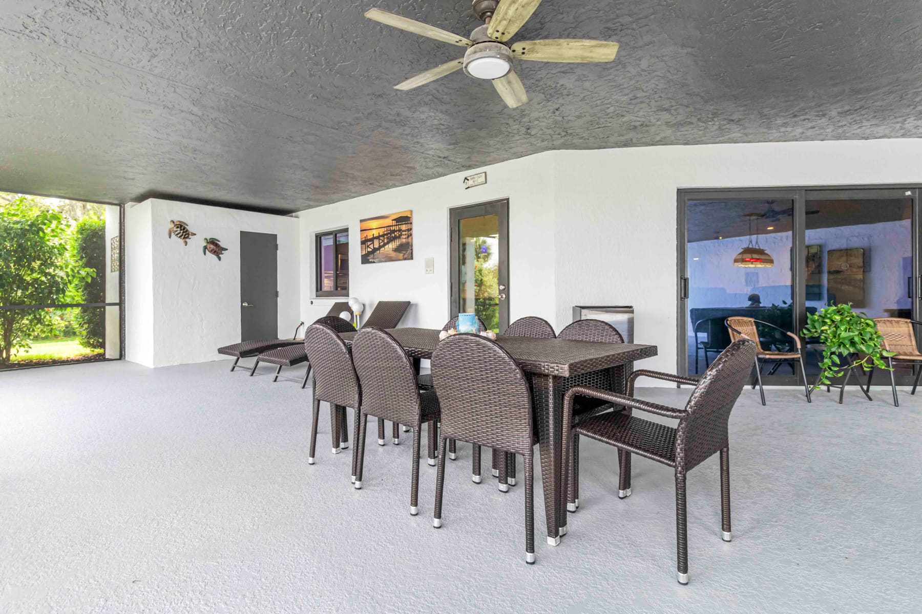 First-floor patio seating near the pool