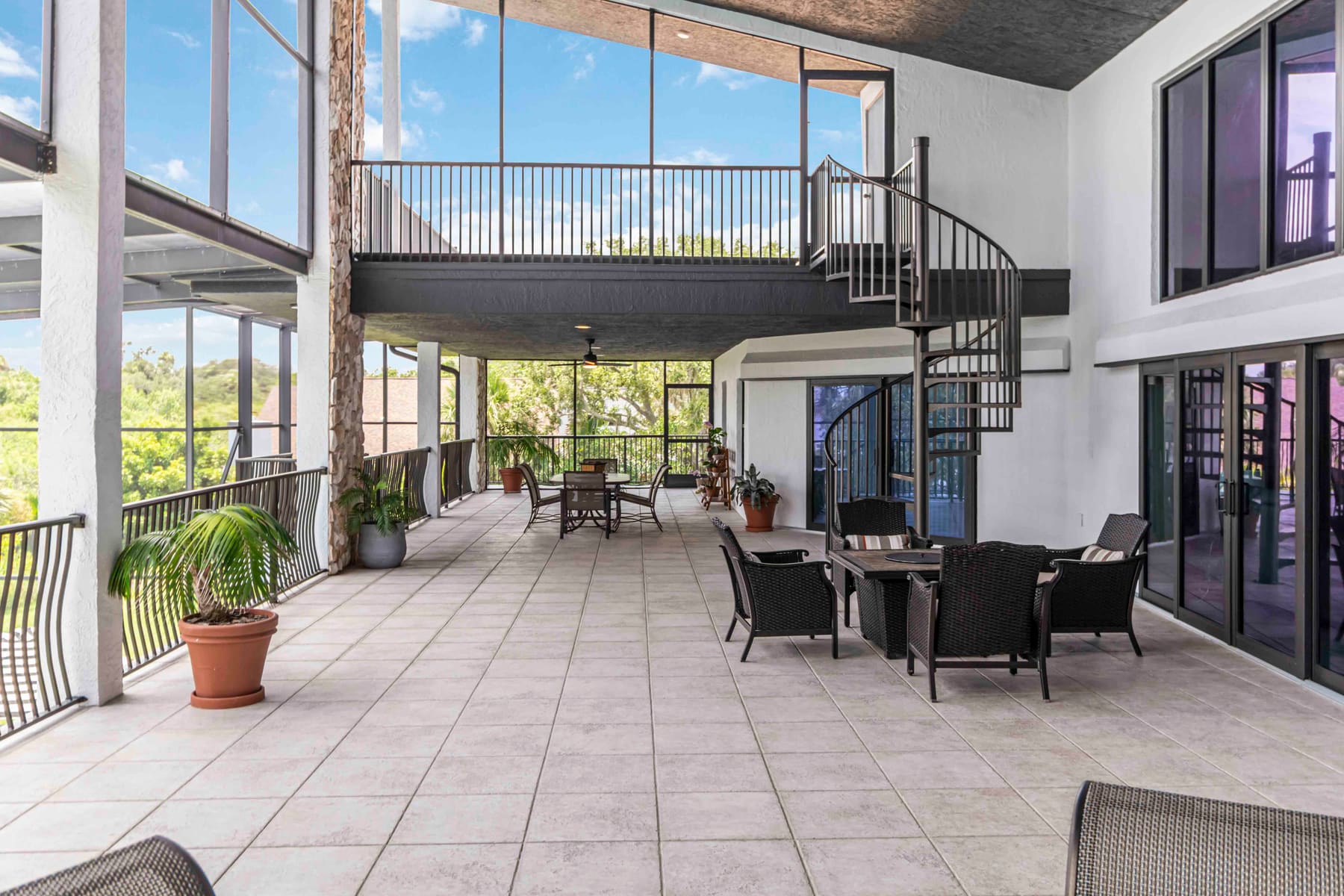 Second-floor patio overlooking the pool and river