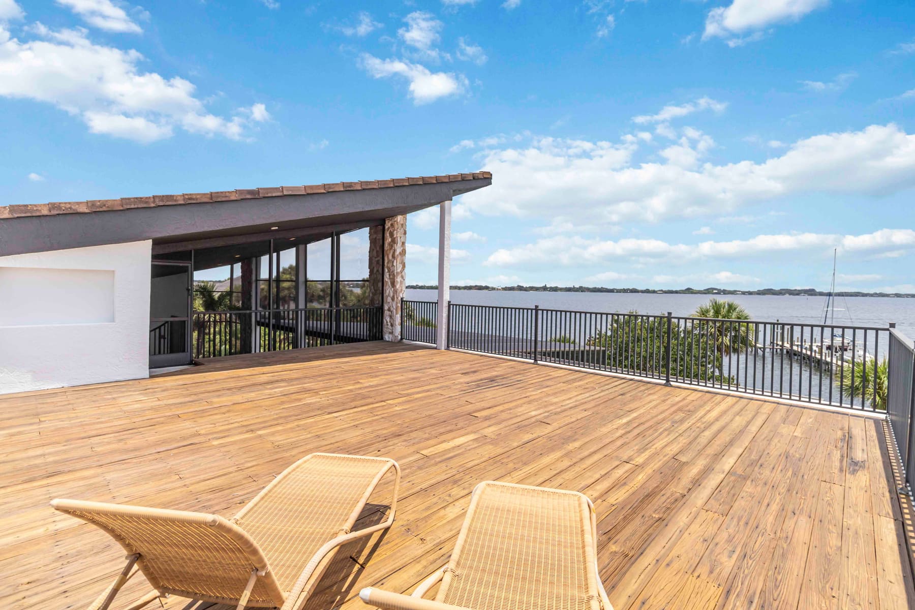 Third-floor sun deck overlooking the water