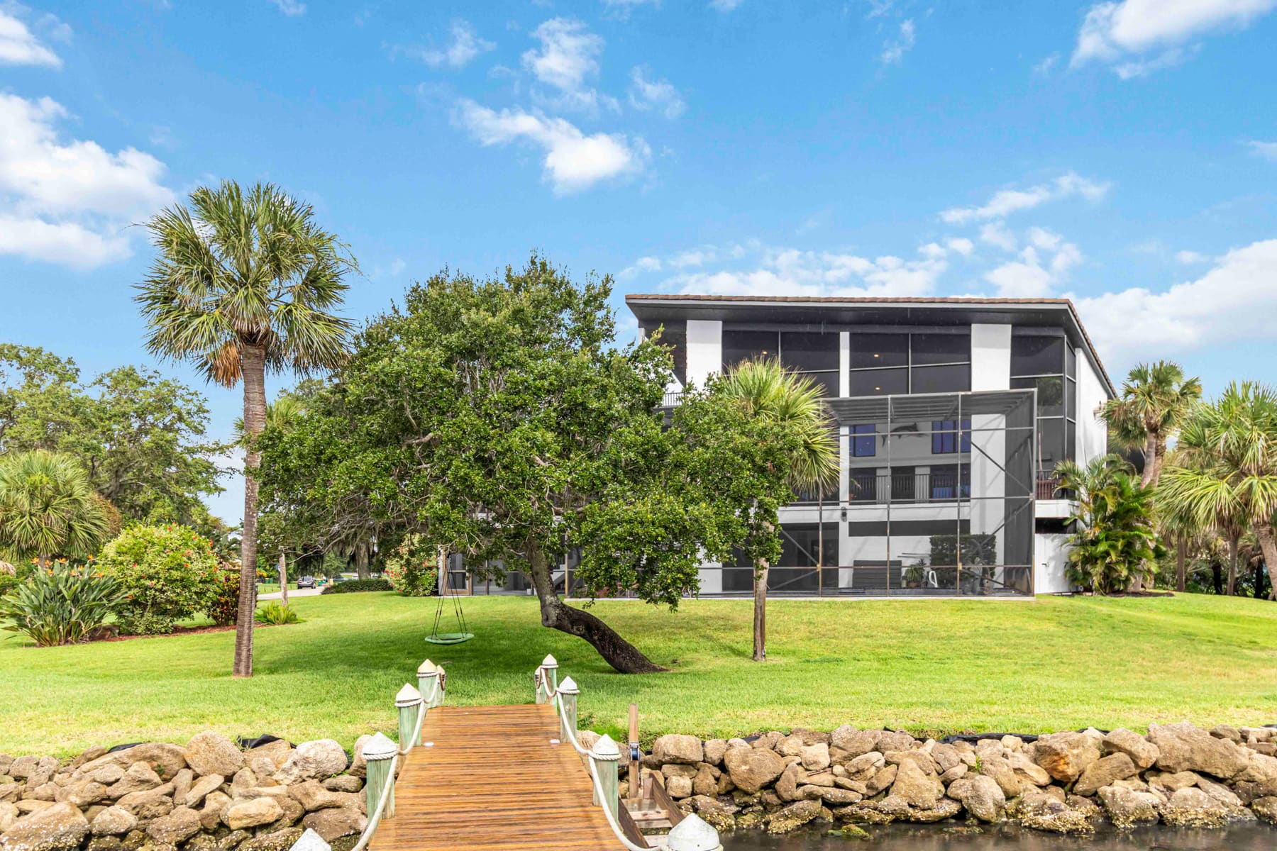 Rear exterior and waterside patio of the home