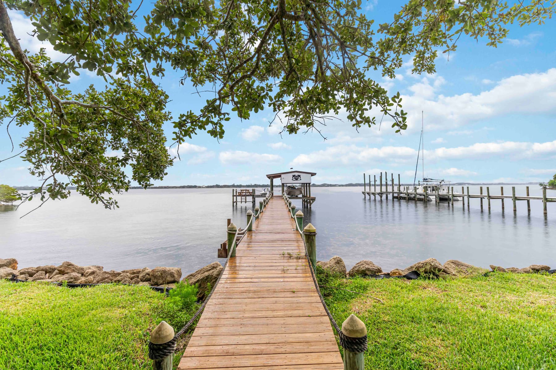 Private dock with boat lift and boathouse