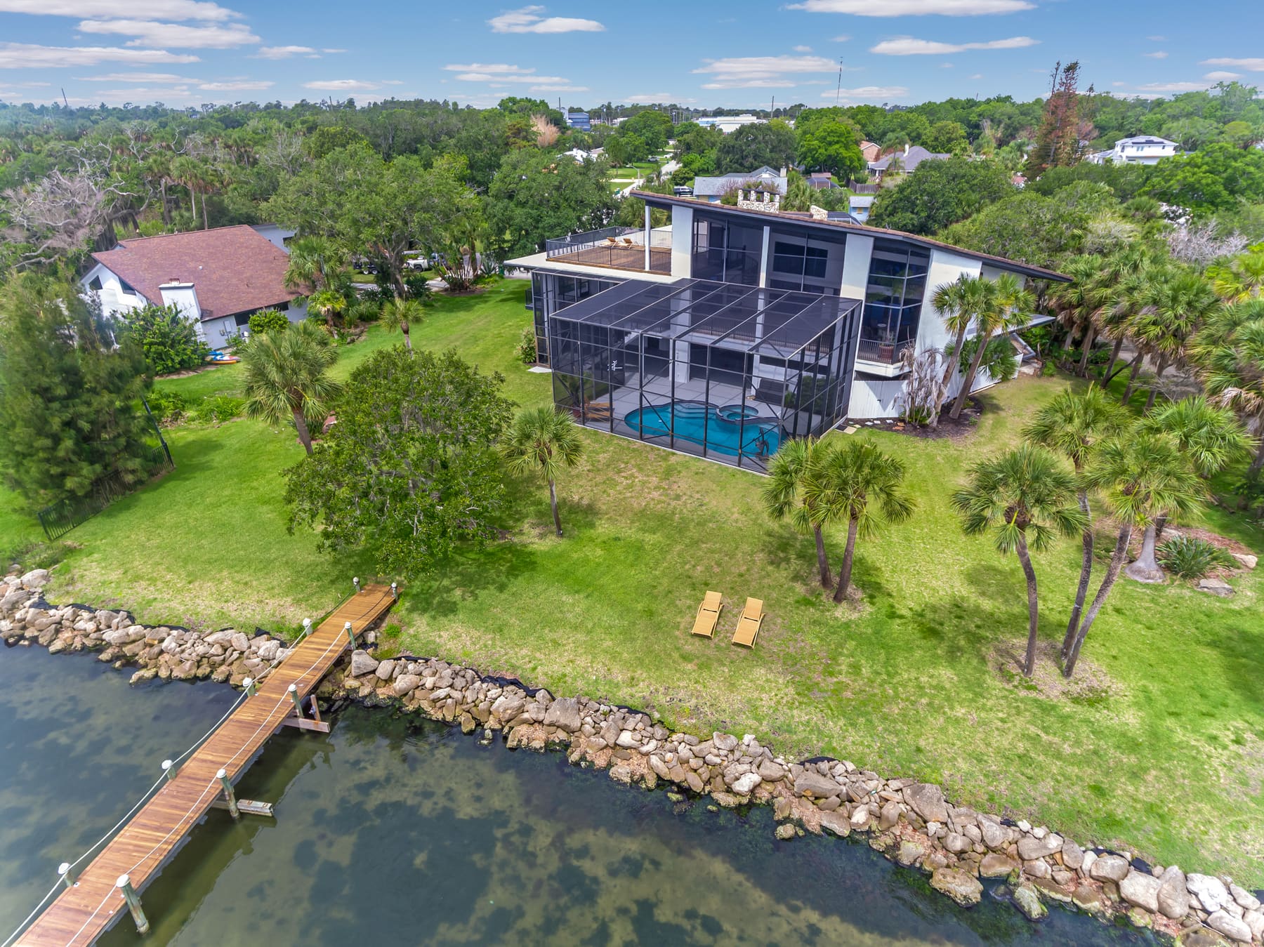 Aerial view of the home's roofline and surrounding grounds