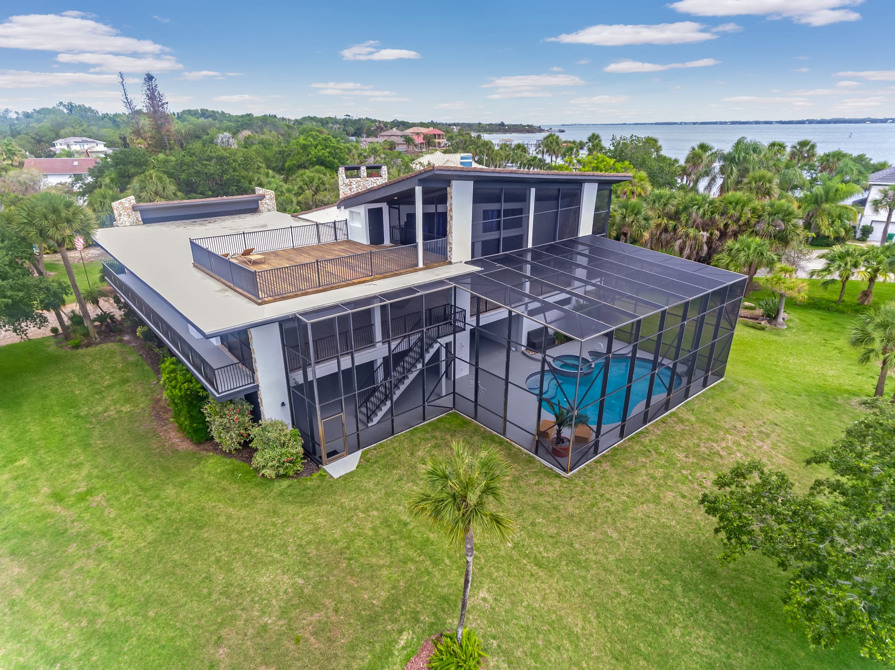 Aerial view of the neighborhood and river frontage