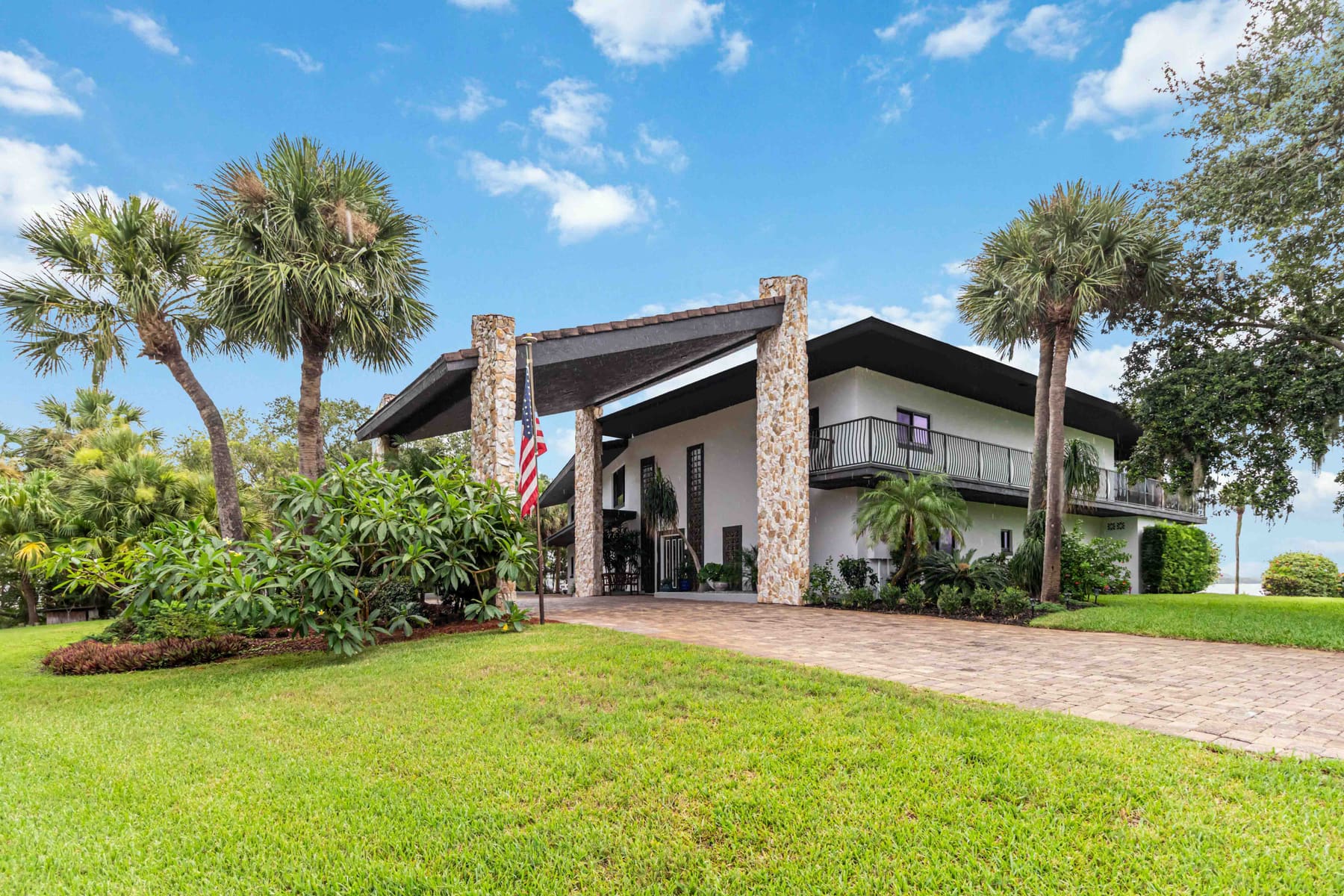 Front exterior of the home showing the driveway and entry